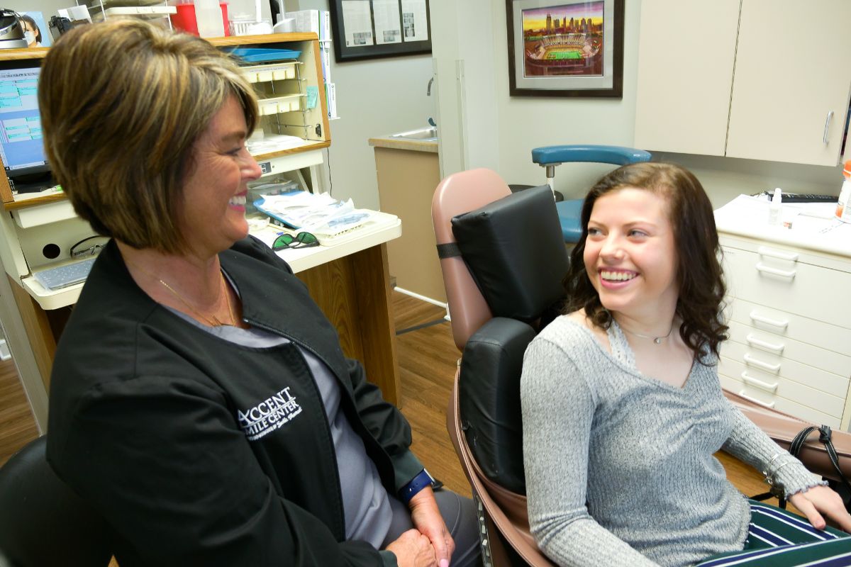 Accent assistant with patient-2 Accent Smile Center assistant talking to a teen patient