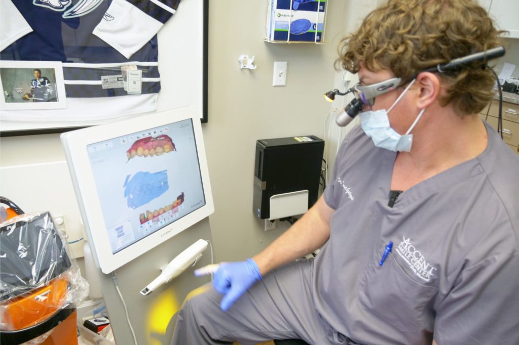 Dr. Gatgens looking at dental scans