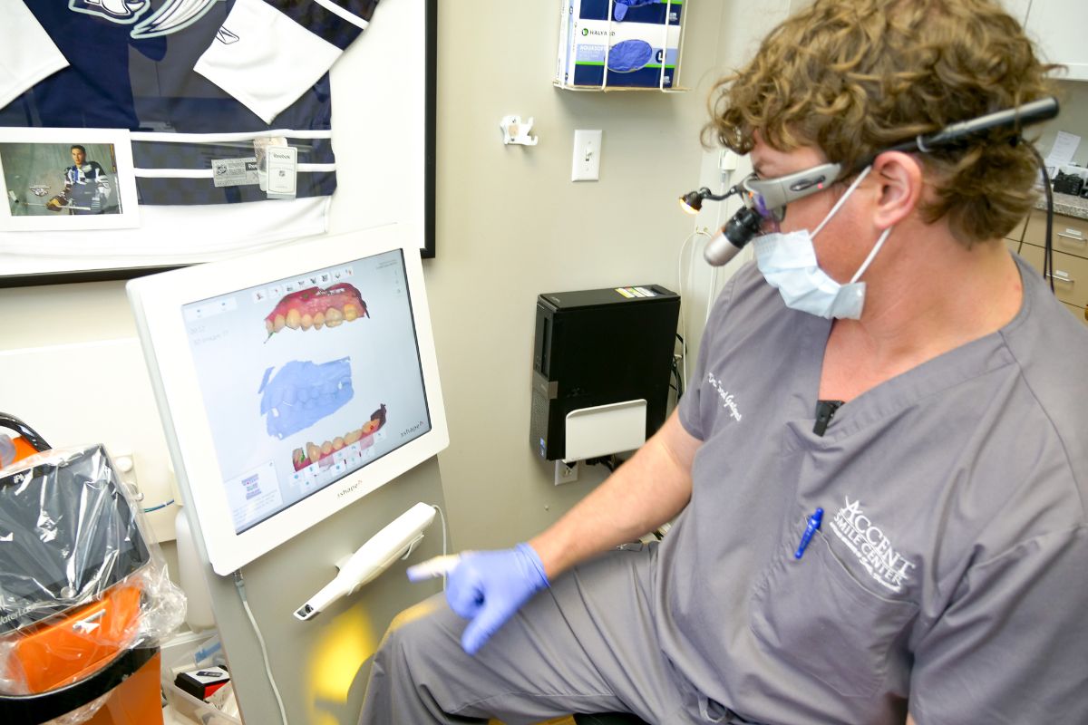 Dr. Gatgens looking at scans